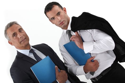 Businessmen holding folders