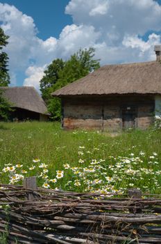 Old farmhouse with a thatched roof.