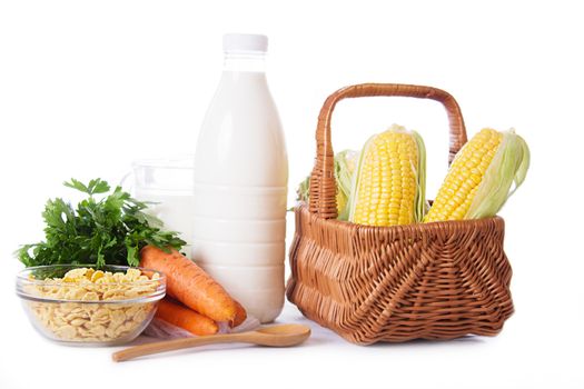 Milk, cereals and some vegetables isolated on white