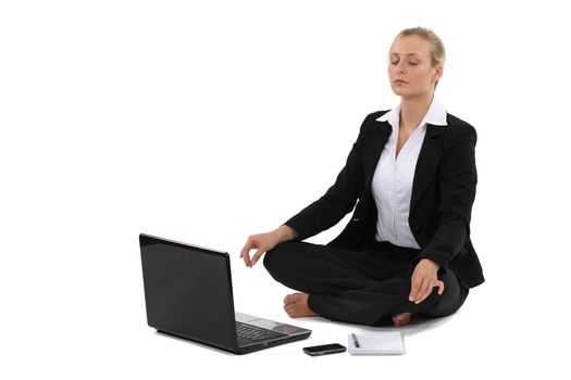 Businesswoman in yoga position