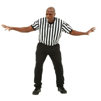 Attractive fit black man in referee uniform facing front and blowing whistle.