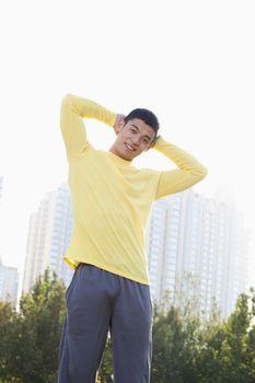 Young Athletic Man Standing in a Park in Beijing