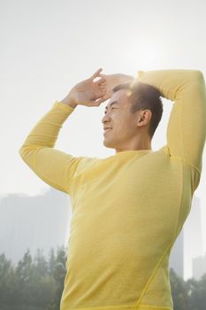 Young Muscular Man Stretching