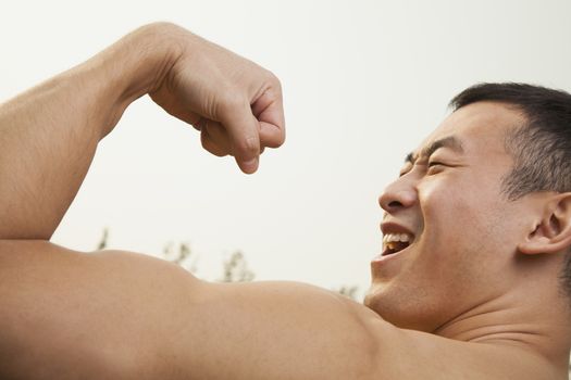 Man Flexing Muscles