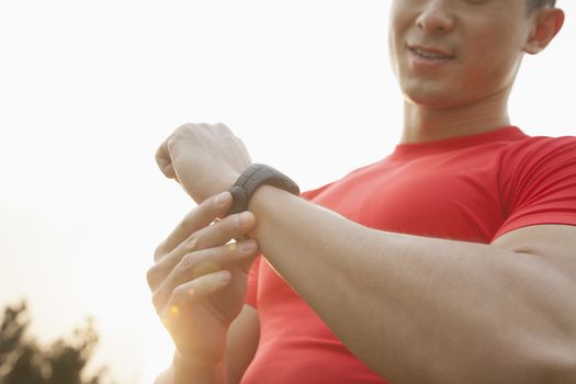 Muscular Man Checking His Watch