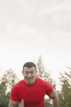 Muscular Man Running Toward Camera