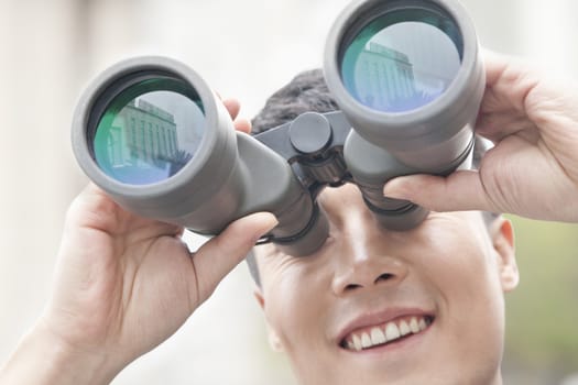 Close Up of Businessman Using Binoculars, Reflection