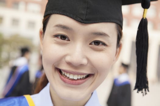 Young Female Graduate Smiling, Close Up