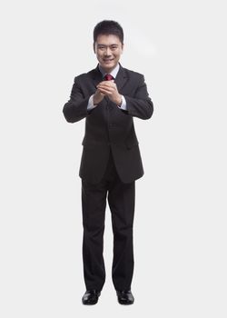 Businessman Bowing Toward Camera