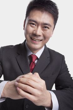 Businessman Bowing Toward Camera