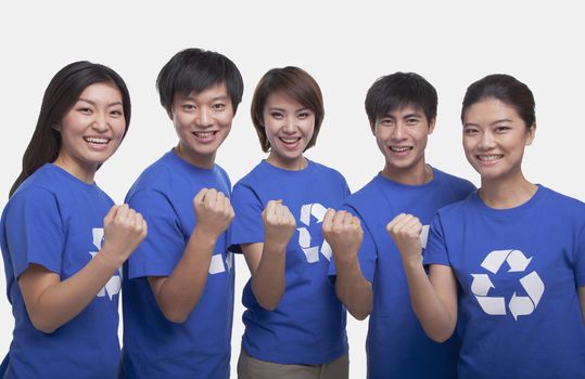 Group of people with raised fists, studio shot