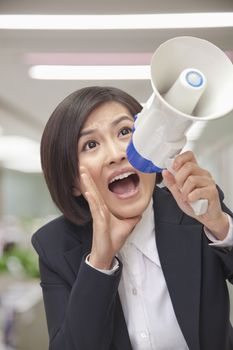 Young Businesswoman with Megaphone