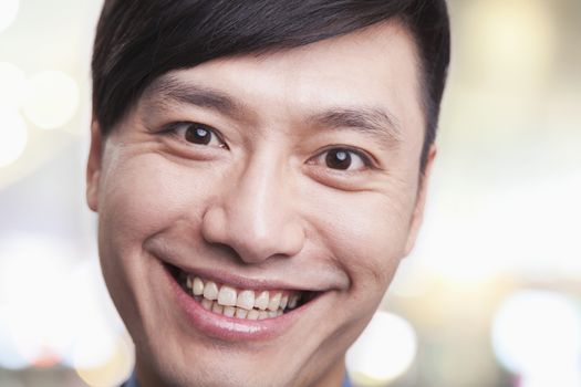 Close up portrait of young man smiling, Beijing