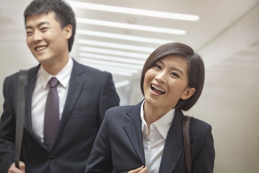 Two Business People Walking Together