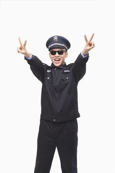 Police Officer Giving Peace Sign, Studio Shot