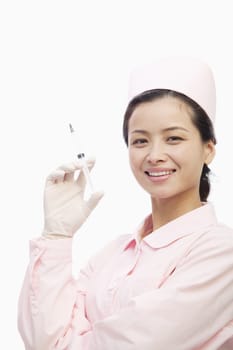 Portrait of Nurse Holding A Syringe, Studio Shot