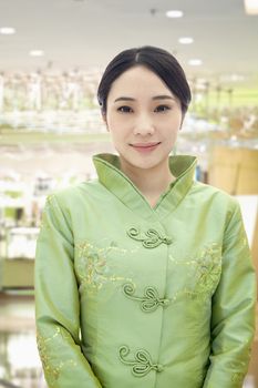 Restaurant/Hotel Hostess in Traditional Chinese Clothing 