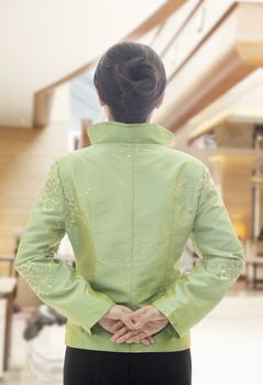 Restaurant/Hotel Hostess in Traditional Chinese Clothing, View From Behind