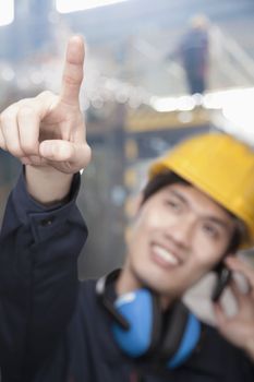 Portrait of Young Engineer Pointing