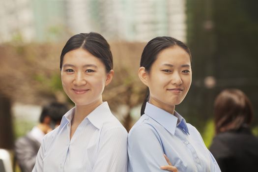 Portrait of two young businesswomen in Beijing
