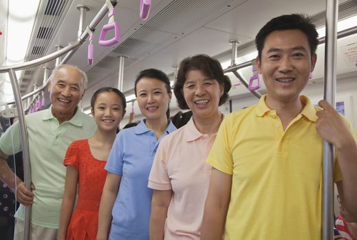 Family standing in the subway, portrait