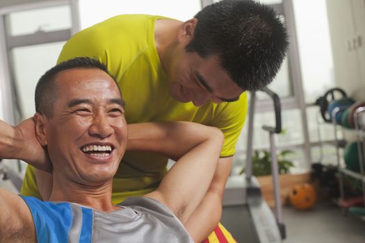 Man working out with his trainer