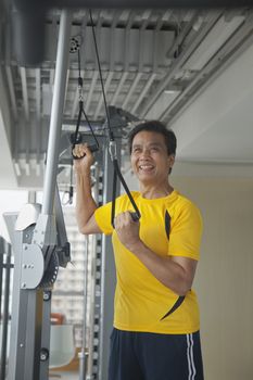 Mature man working out in the gym