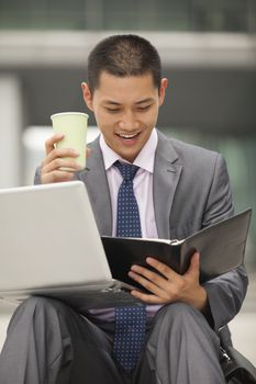 Young businessman working outdoor