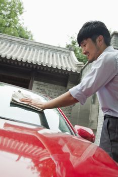 Young Man Cleaning His Car