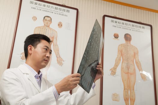Doctor Looking at X-Ray