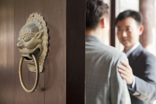 Businessmen in Doorway