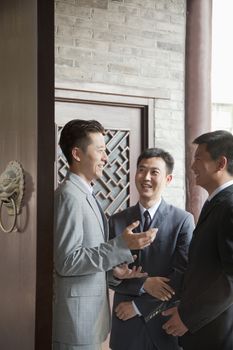 Businessmen in Doorway