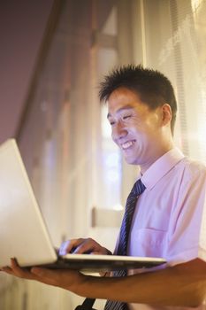 Young businessman with his laptop outdoor