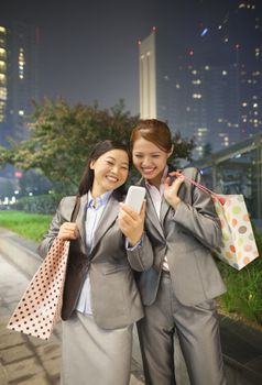 Young businesswoman taking a picture of her self with her cell phone