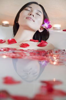 Young Woman Bathing at Health Spa