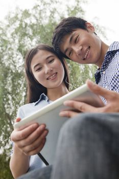 Couple Looking at Tablet Together