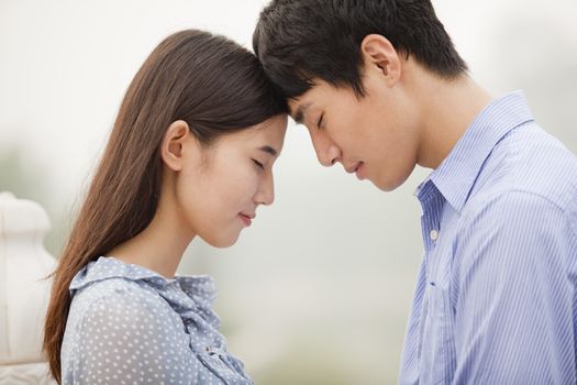 Young Couple Touching Foreheads