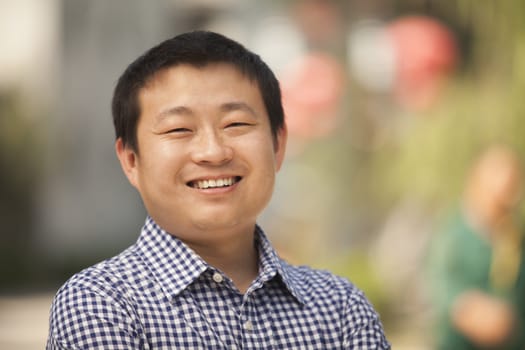 Portrait of Mid Adult Man in Nanluoguxiang, Beijing, China