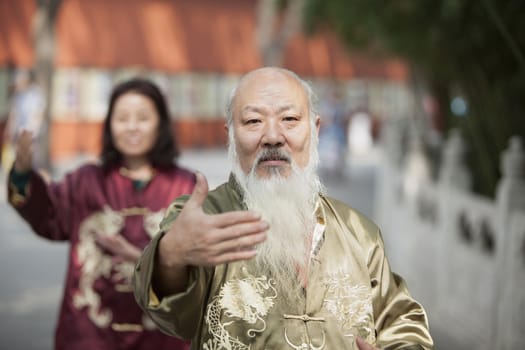 Two Chinese People Practicing Tai Ji