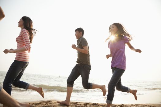 Friends Running at the Beach