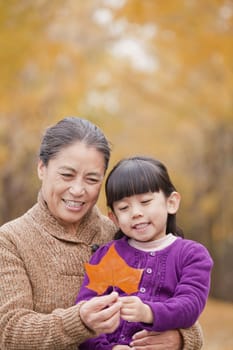 Grandmother and granddaughter in park