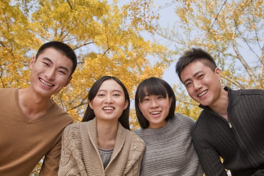 Portrait of young group of people in park