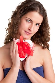 Woman holds a heart shaped box with her hands, isolated in white