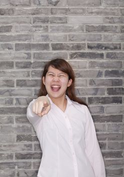 Portrait of Young Woman Pointing