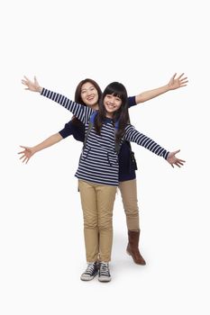 Mother and daughter with open arms portrait