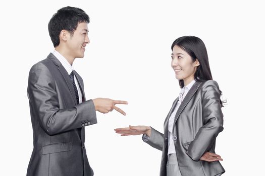 Businessman and businesswoman in playful gesture