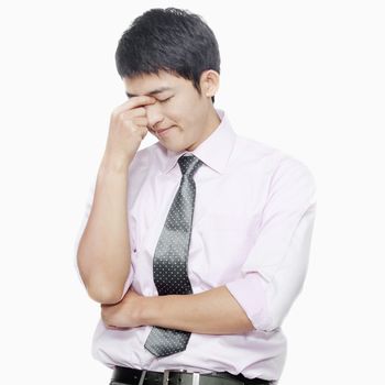 Young man with eyes closed thinking