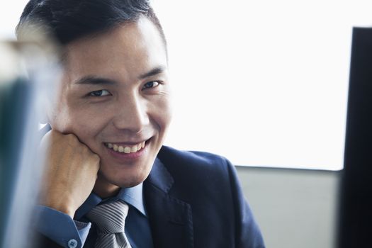 Businessman smiling in office