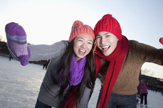 Young couple at ice rink