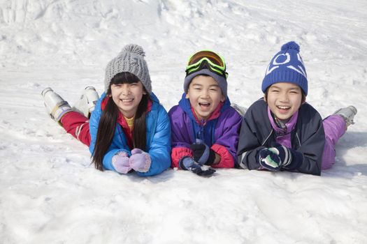 Children Lying on the Snow